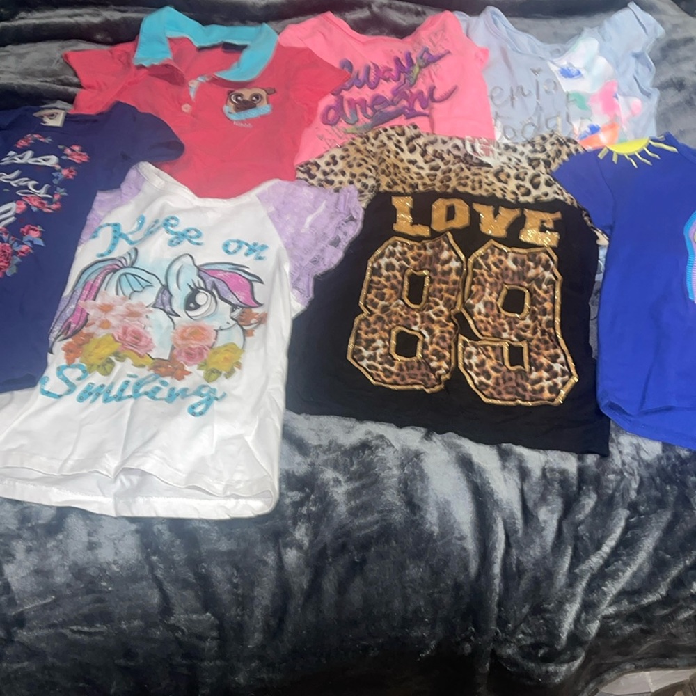 7 pairs of little girls size 7 shirts